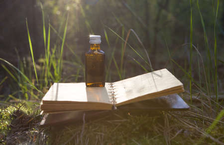 Mystic still life with old book, bottles.の写真素材