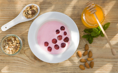 Healthy breakfast. Oatmeal with cherries and honey. FLATLAY,