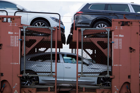 Poznan, Poland - May 17, 2019: New cars transported with railway platforms. Cars transported by...