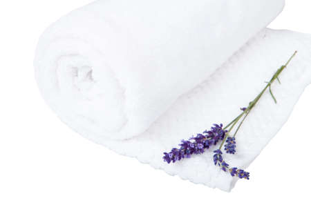 A rolled towel and a lavender flower - aromatherapyの写真素材
