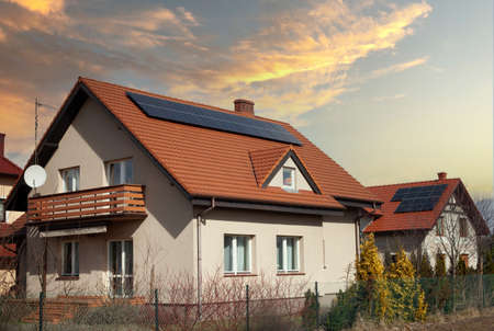 Solar panels roof of a modern house - photovoltaic on a home roof.の写真素材