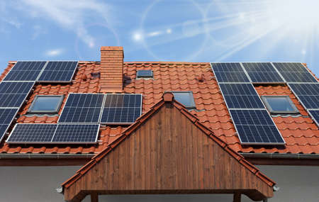Solar panesl or photovoltaic plant on the roof of a houseの写真素材