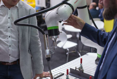 Poznan, Poland 01 Sep 2021: Fanuc robot CRX-10iA, collaborative robots, close-up. Robot arm in technology process, automatic industrial robot. ITM Industry Europe, HIGH TECH-EXPO.のeditorial素材