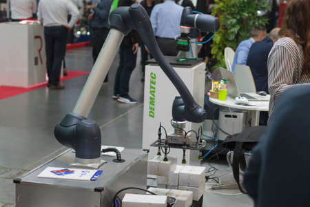 Poznan, Poland 01 Sep 2021: ITM Industry Europe, high-tech EXPO. Doosan Robot arm in technology process, automatic industrial robot. Collaborative robots.のeditorial素材