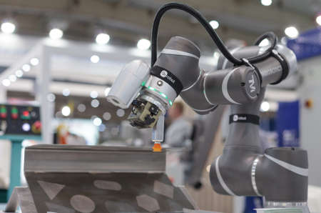 Poznan, Poland 01 Sep 2021: ITM Industry Europe. Robot arm in technology process, automatic industrial robot. TM ROBOT collaborative robots.のeditorial素材