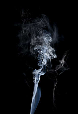 Close-up of clouds of smoke on black background.の写真素材