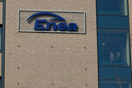 Poznan, Poland - March 24, 2020: Logo of ENEA brand, the main supplier of energy and electricity in Poland. Logo on the office building.のeditorial素材