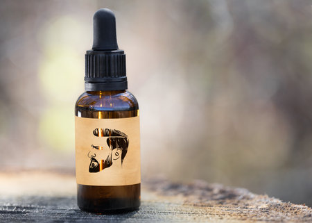 Natural oil for beard care and growth, hairdresser - MOCK UP. Spa care and beard growth oil for man in dropper. Concept Barbershop - mockup.の写真素材