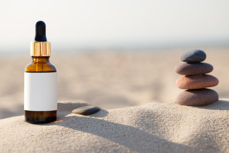 Concept of natural calming product at the beach. Bottle with blank label. Pebbles and bottles.の写真素材