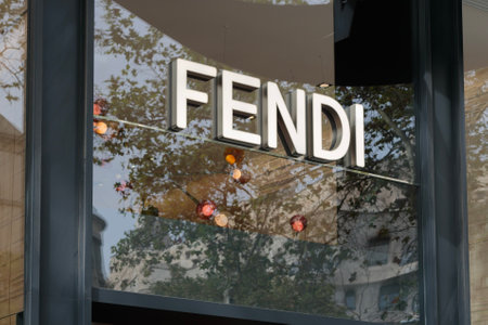 Detailed view of the Fendi logo with the store's entrance and window in the backdrop in Barcelona.のeditorial素材