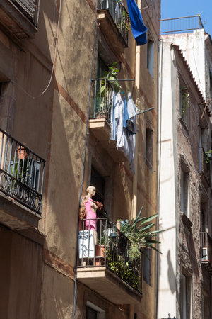Barcelona, Spain - 09 August 2023 Quirky Mannequin Balcony Scene in Barcelonaのeditorial素材