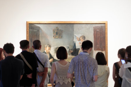 Visitors engrossed in Picasso's masterpiece 'Science and Love' in Barcelona's Picasso Museumのeditorial素材