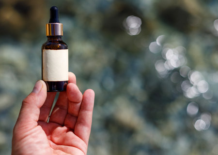 Cosmetic Dropper Bottle: Hand-held Beauty Elixirの写真素材
