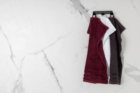 Maroon and White Towels on Rackの写真素材