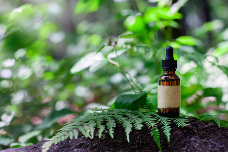 Dropper Bottle on Forest Floor, Blank Labelの写真素材