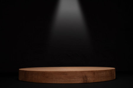 Empty Wooden Pedestal Under Spotlightの写真素材
