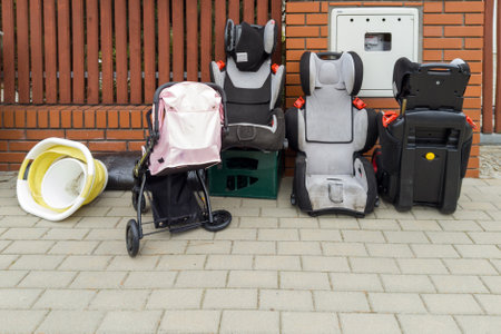Old Child Car Seats and Stroller Awaiting Collectionの写真素材