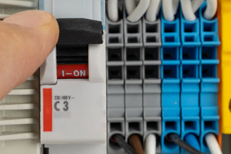 Switching on electrical circuit breaker in control panelの写真素材