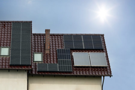 House Roof with Solar Panels Under Sunny Sky