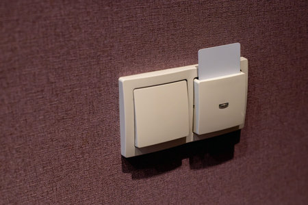 Hotel Room Card Power Switch on Textured Wall