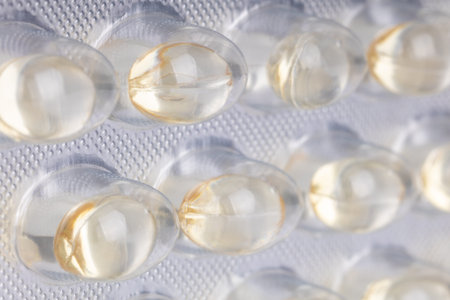 Angled macro view of gel capsules in blister pack