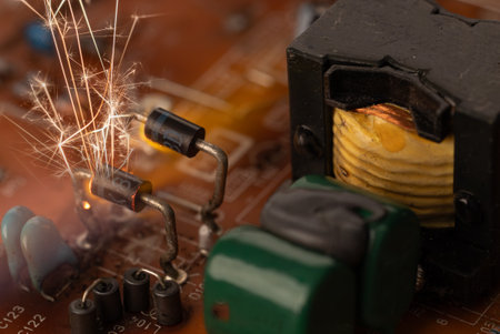 Sparks on Circuit Board Highlighting Fire Risksの写真素材