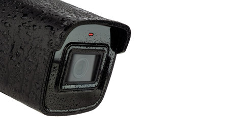 Wet Black Security Camera Isolated Whiteの写真素材
