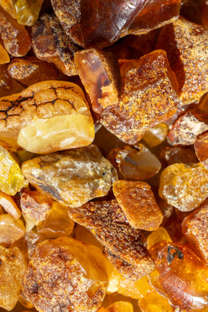 Rough Amber Gemstones Pile Macro Textureの写真素材
