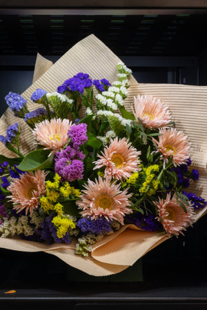 Colorful flower bouquet in vending machine compartmentの写真素材
