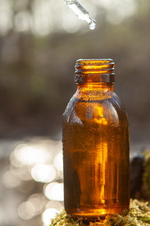 Glass dropper with amber medicine bottleの写真素材