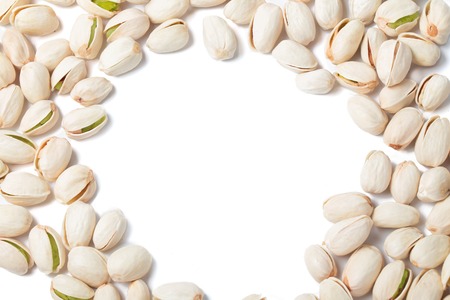 pistachio nut  top view frame isolated on white backgroundの写真素材