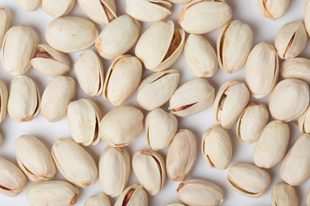 roast salty pistachio nut snack on white backgroundの写真素材