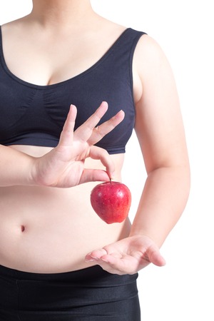 fat woman asian hold apple healthy diet concept isolated on whiteの写真素材