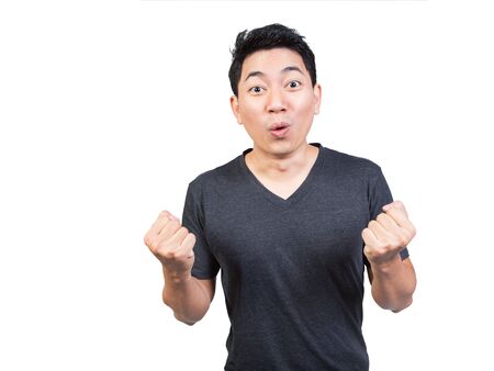 young man face very amazed surprise expression hand punch and open mouth on white backgroundの写真素材