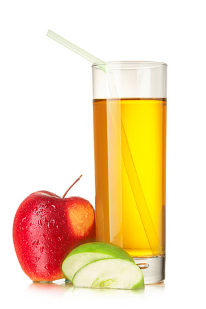Fresh, clarified apple juice in highball glass with drinking straw, ripe red apple and green apple slicesの写真素材
