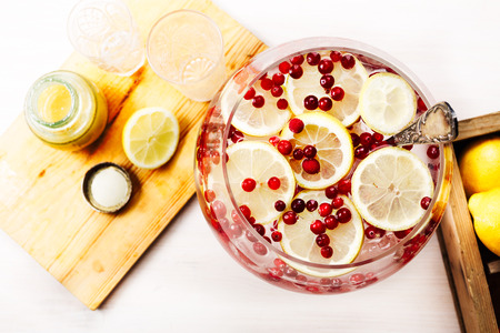 Cranberry lemon detox water in a glass jar. Healthy water with infused wild cranberry, cowberry and lemonの写真素材