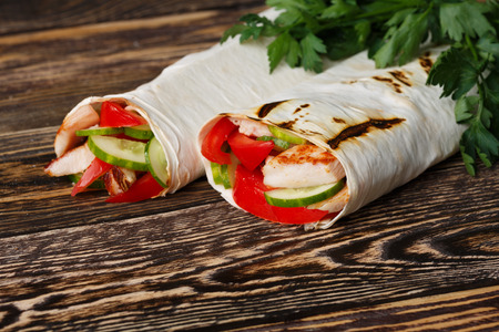 Traditional shawarma wrap with chicken and vegetablesの写真素材