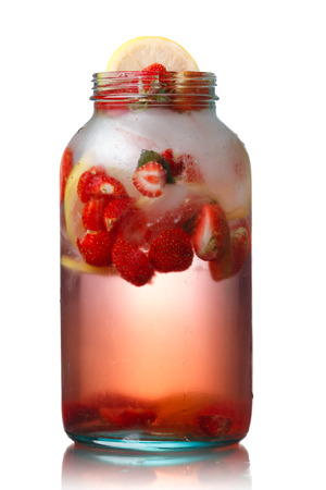 Strawberry lemon detox iced water in a glass jar.  Infused water. Healthy, clean eatingの写真素材