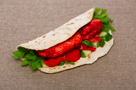 Chicken Tikka masala naan sandwich. Indian takeaway. Selective focus