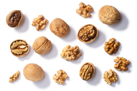 Walnuts (Juglans regia seeds), whole, shelled, halves and partially cracked, top viewの写真素材