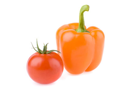Tomato and orange sweet pepper on a white background.の写真素材