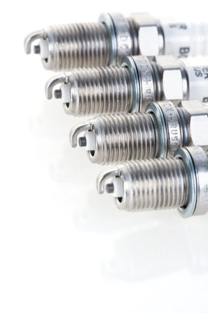Set of spark plugs for the car on a white background