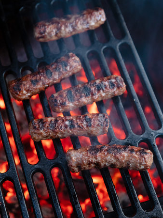 beef steak on the grill with flames, closeup of photo
