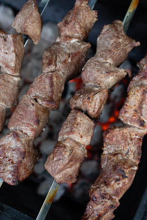 Grilled kebab on skewers on a barbecue grill.の写真素材