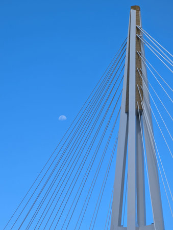 Kangaroo Point Bridge tower and cables with moon in clear blue sky, Brisbane, Australia