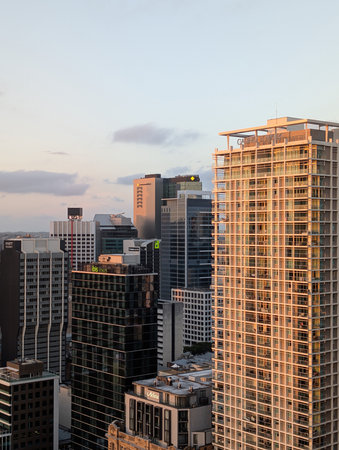 Brisbane Australia November 30 2025 city skyline with hotel and bank logos at sunsetのeditorial素材