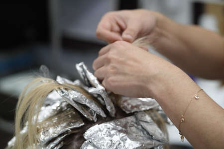 Work in a hairdressing salon. Hair dyeingの写真素材