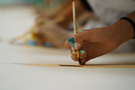 Hand drawing with paints on canvas. Drawing lessons at children's art school.