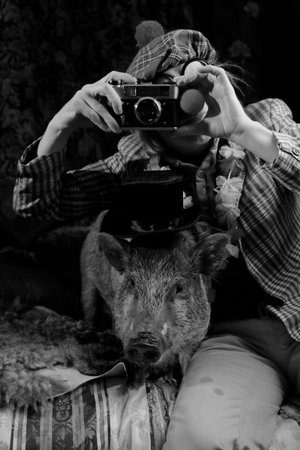 Pig and dove acting like humanの写真素材