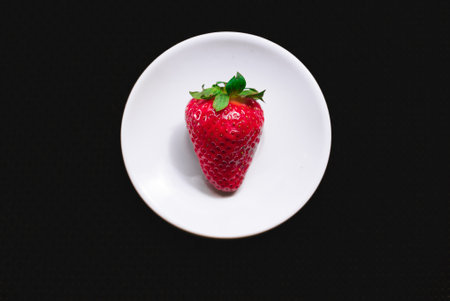 A Cup of coffee with some strawberry on different backgroundの写真素材